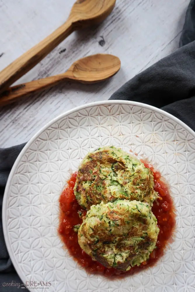 overhead of a plate with Zucchini Tuna Fritters with Tomato sauce