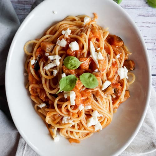 plate of spaghetti with tomato sauce and mozzarella