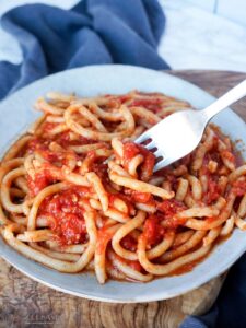 pici pasta with garlic tomato sauce