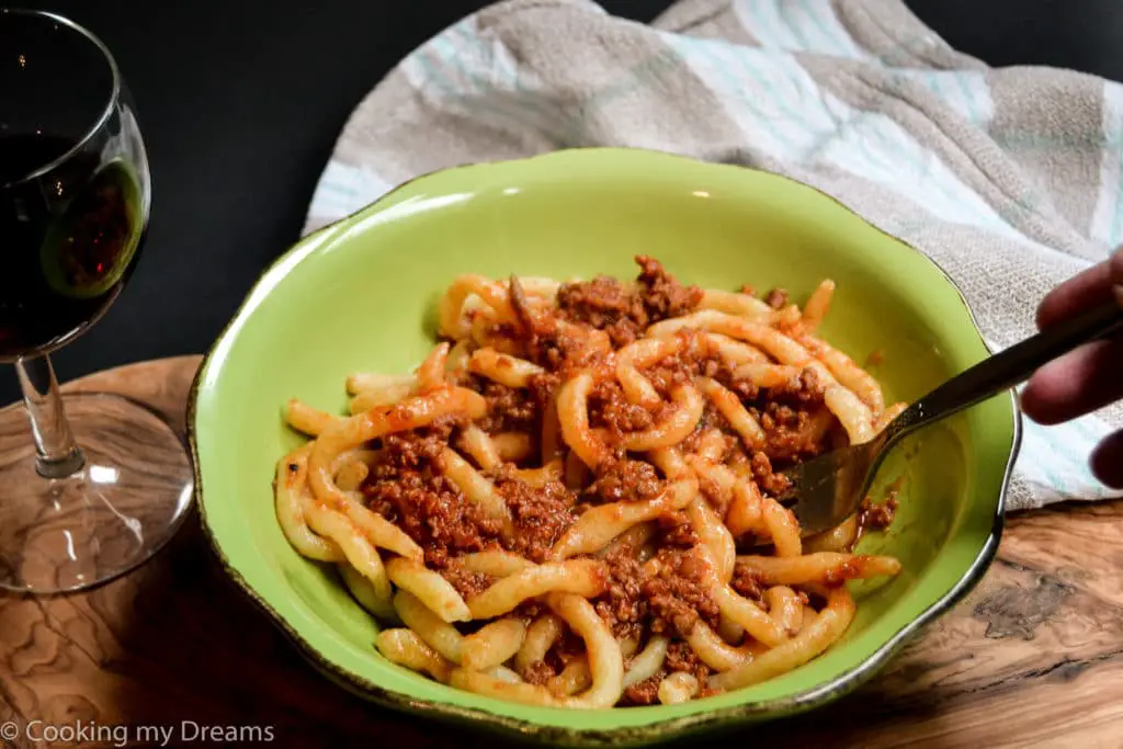 plate of pici pasta with tuscan ragu