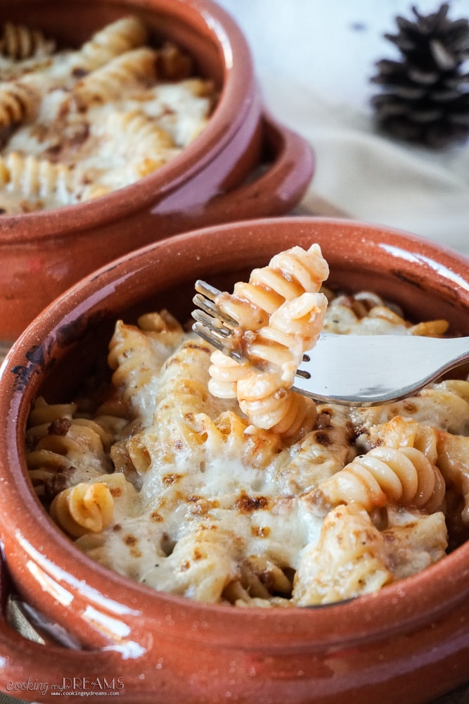 Terracotta bowls with Pasta al forno, Italian pasta bake