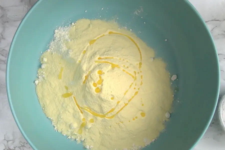 semolina flour and oil in a blue bowl