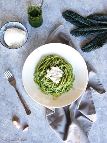 overhead shot with spaghetti with cavolo nero pesto and burrata