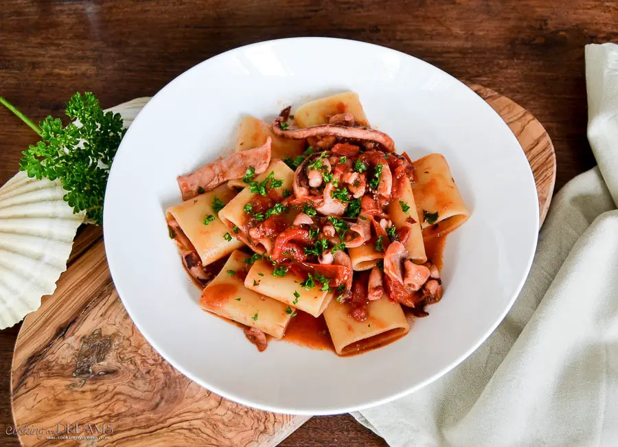 calamarata pasta with squids and tomato sauce