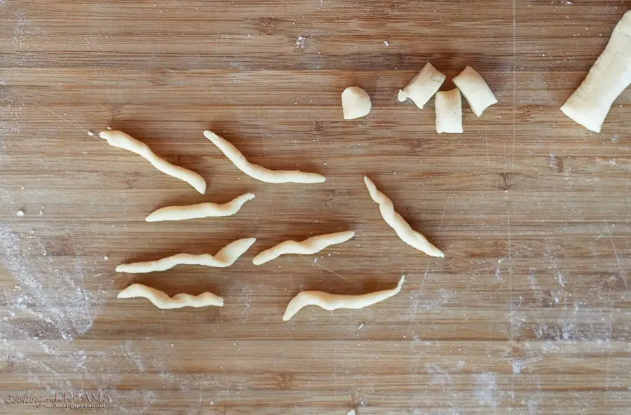 trofie pasta on a cutting board