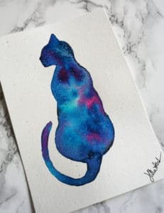 watercolor painting of a cat silhouette in galaxy colors