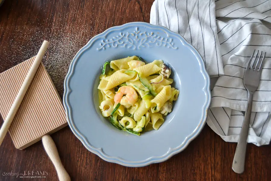 homemade garganelli pasta with seafood and zucchini