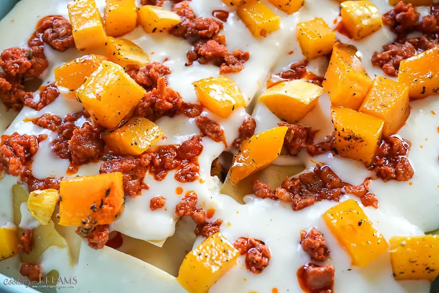 close up of raw lasagna with butternut squash and sausage