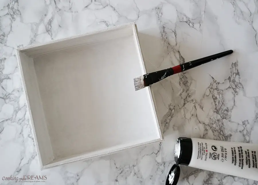 process of painting the box white