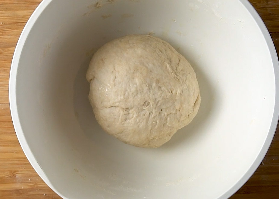 ball of focaccia dough resting in a bowl