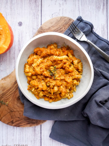 white bowl with pumpkin 'nduja pasta