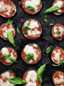 cooked eggplant pizzas on a baking tray