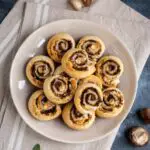 overhead of puff pastry pinwheels on a brown plate