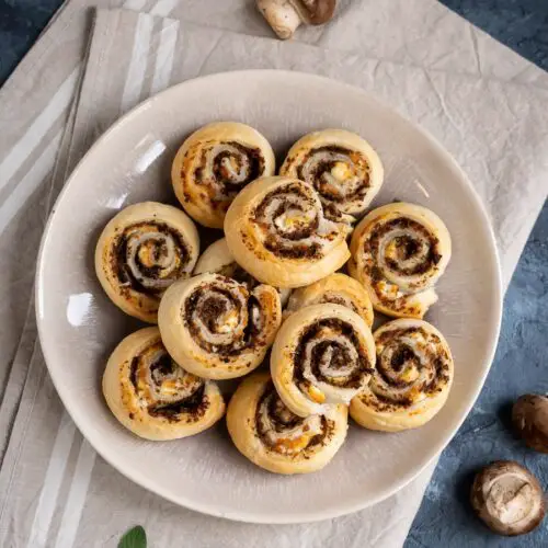 overhead of puff pastry pinwheels on a brown plate