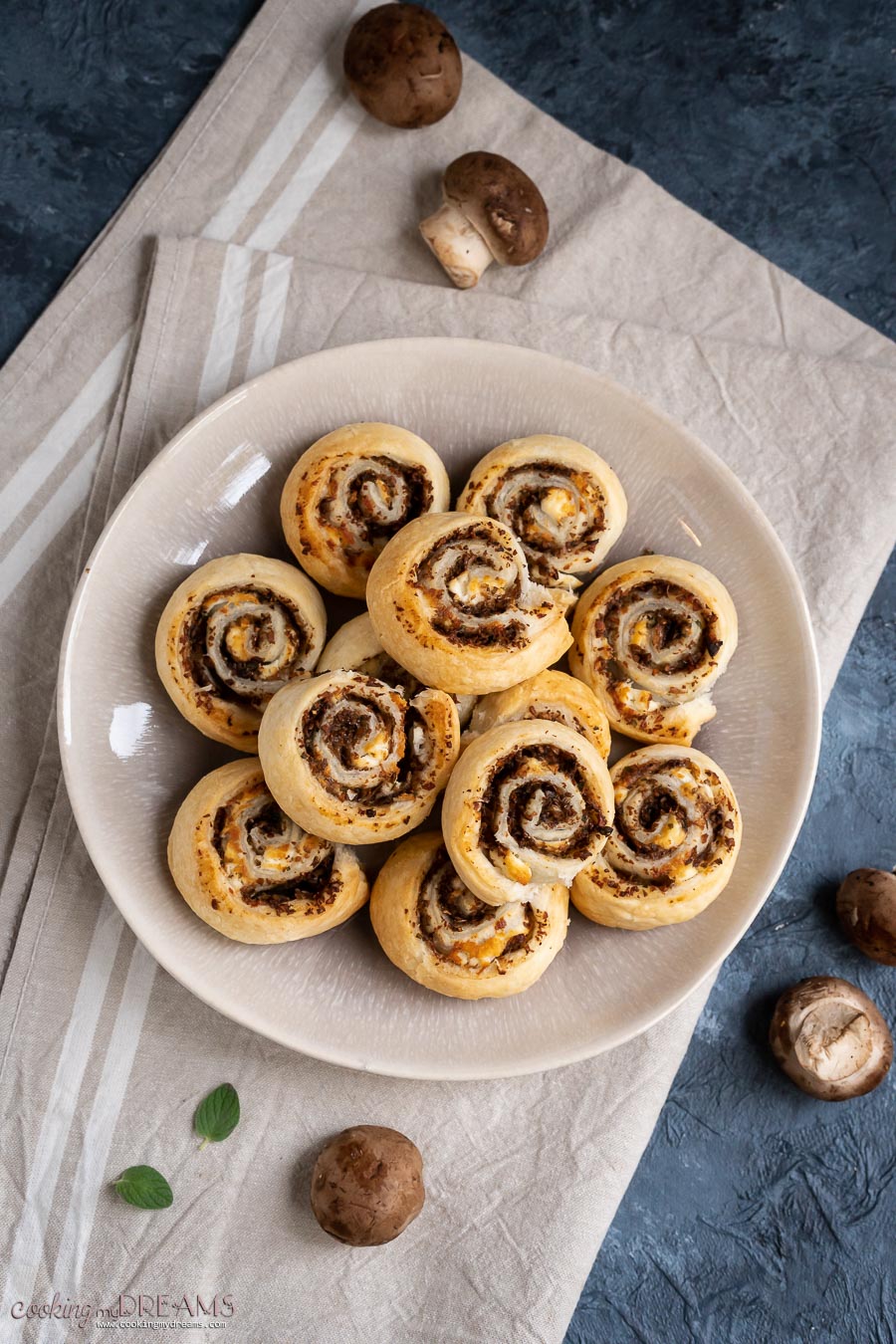 overhead of puff pastry pinwheels on a brown plate