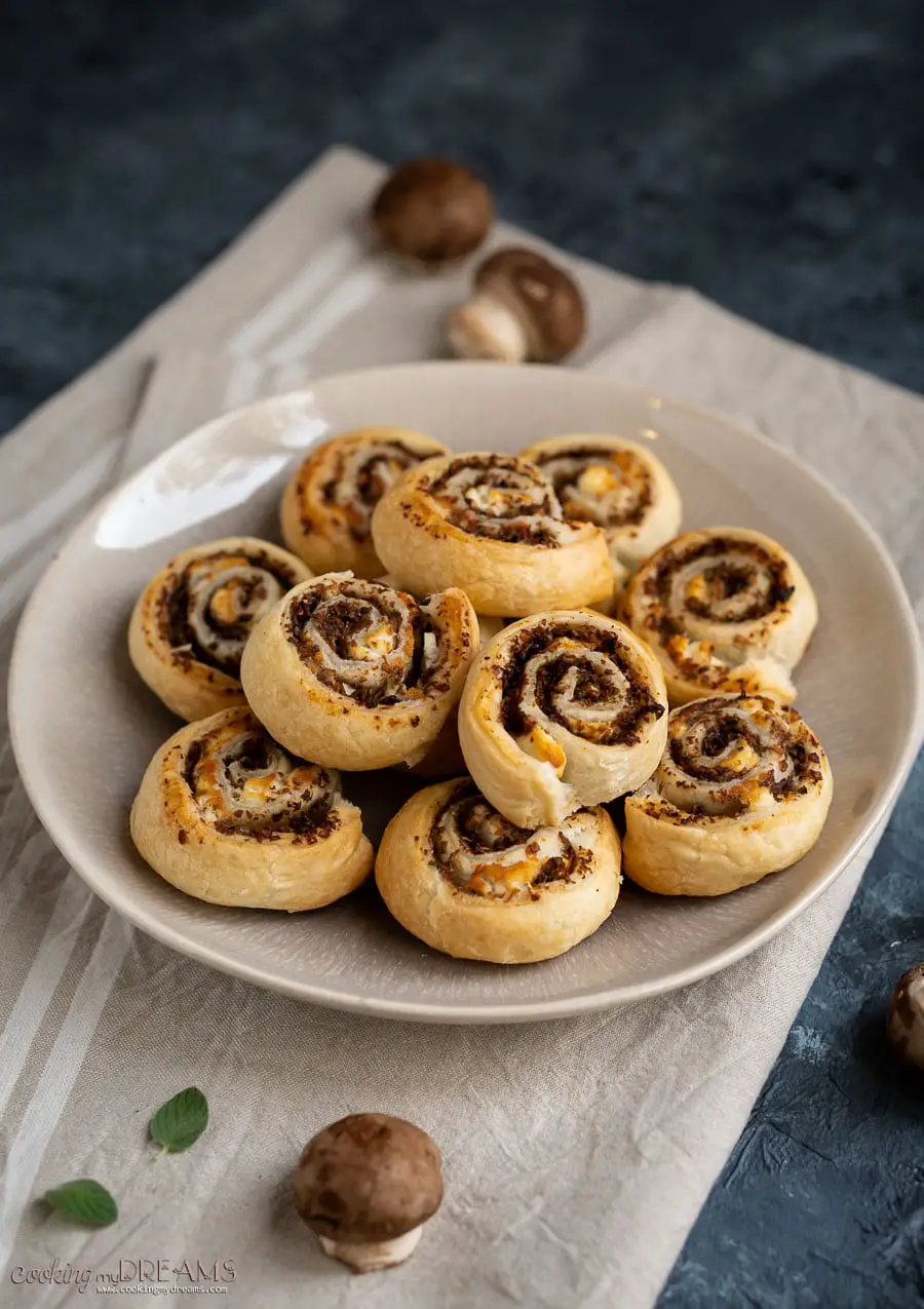 puff pastry pinwheels on a brown plate