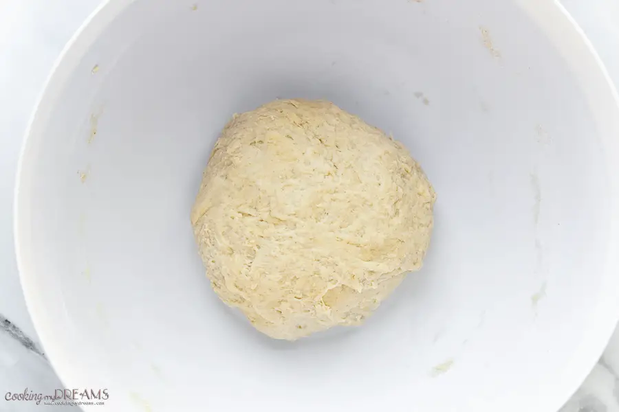 ball of dough in a while bowl
