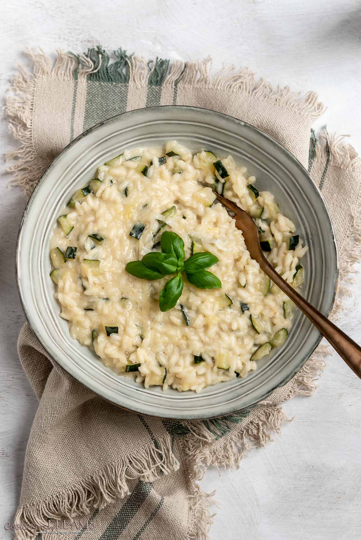 overhead bowl of risotto with a fork