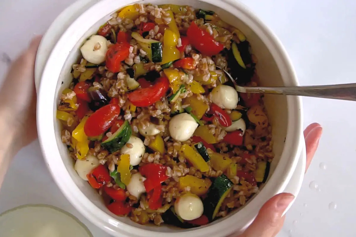 bowl with grilled vegetables farro salad and mozzarella.