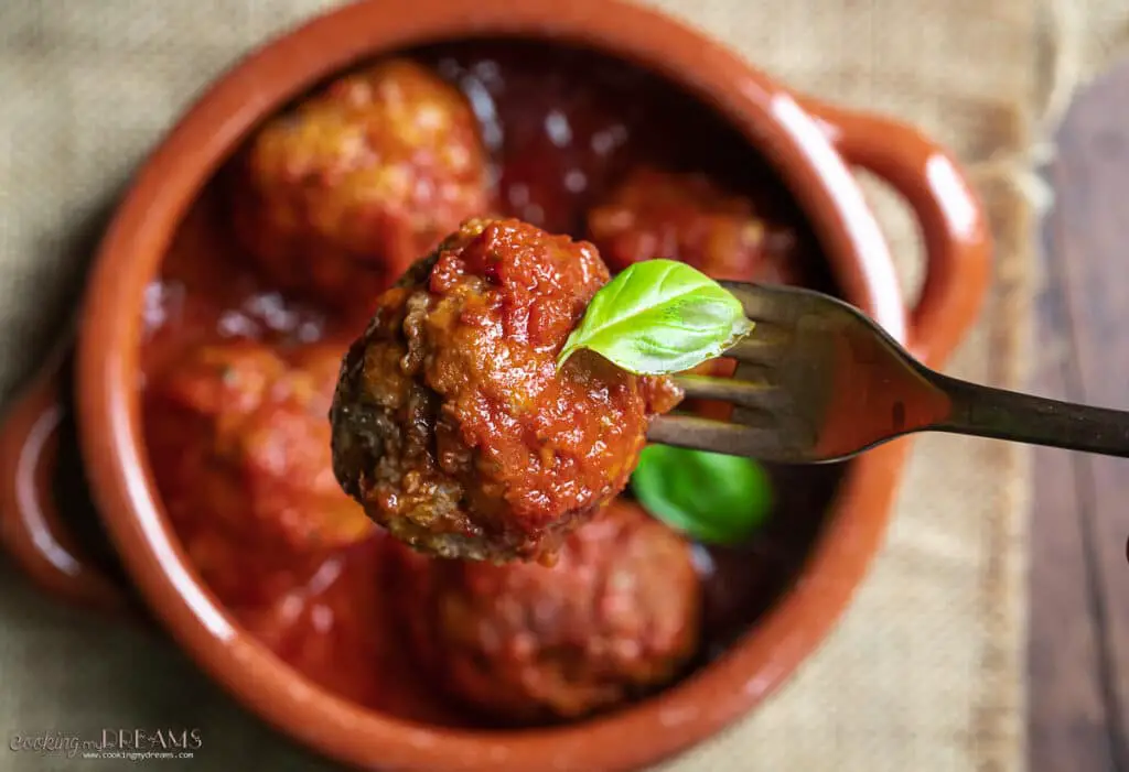 meatball in tomato sauce on a fork