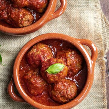 overhead polpette al sugo in a terracotta bowl