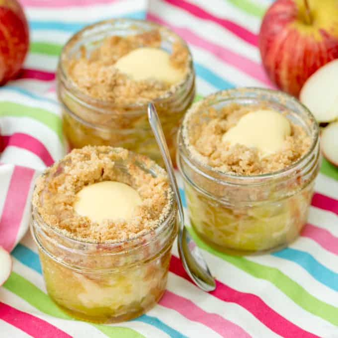 small glasses with apple crumble and custard