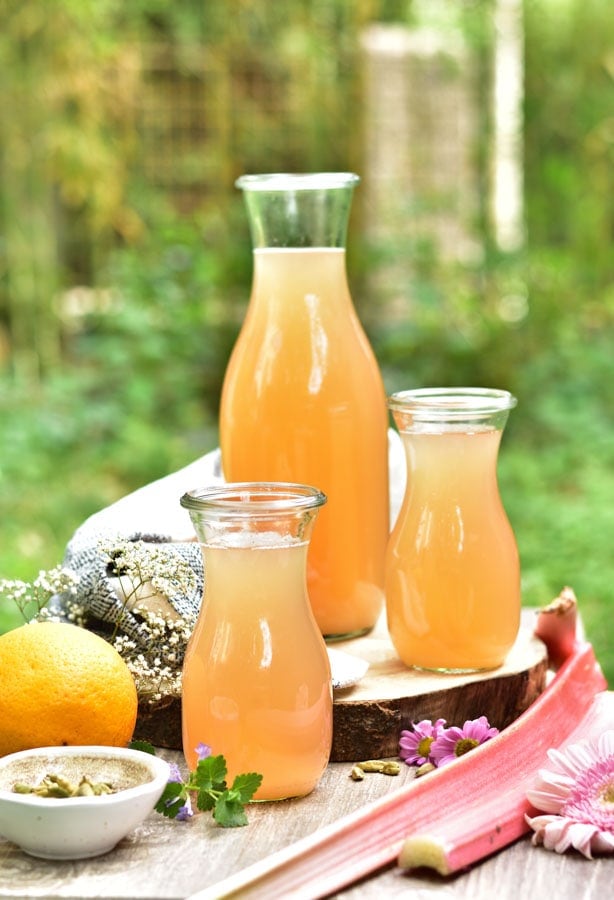jars of rhubarb lemonade on a table outside