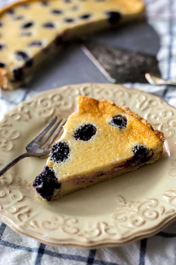 slice of blackberry custard pie on a plate