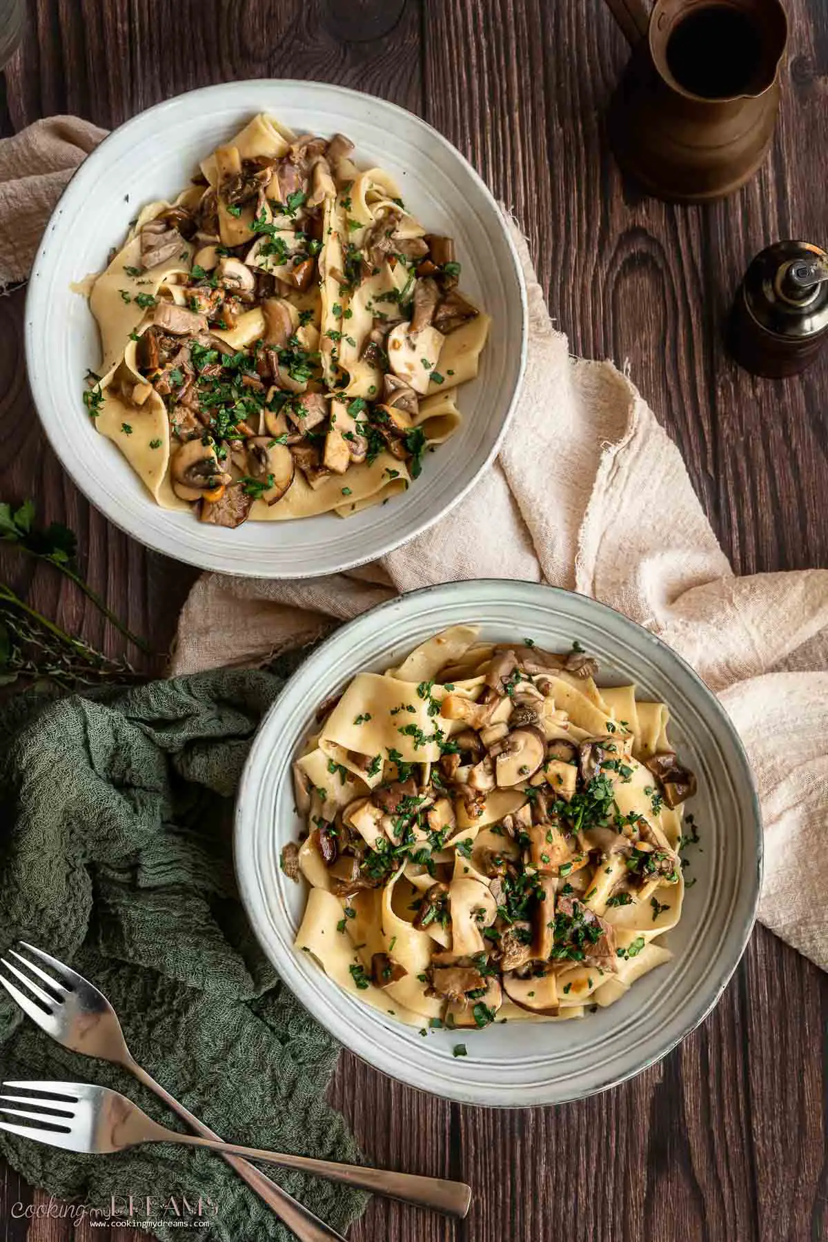 overhead of two bowls with mushroom pappardelle