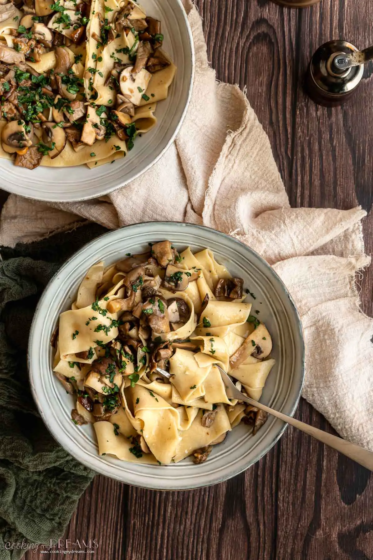 fork taking a portion of pappardelle ai funghi