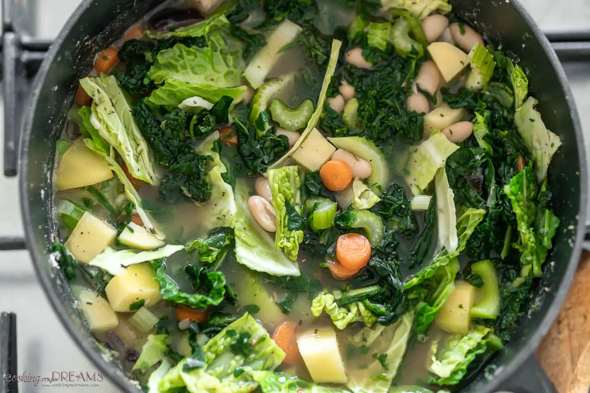 large pot of vegetables and broth to make ribollita