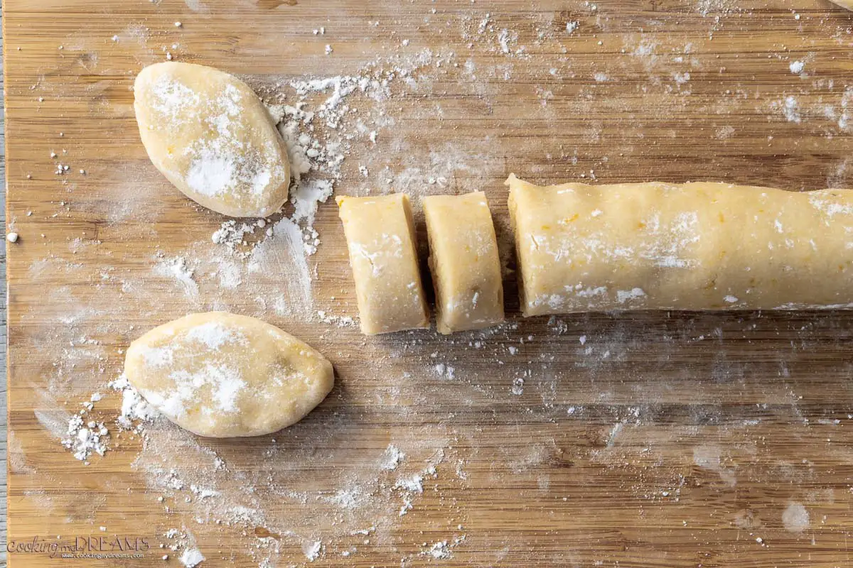 cookie dough is cut and shaped to form ricciarelli