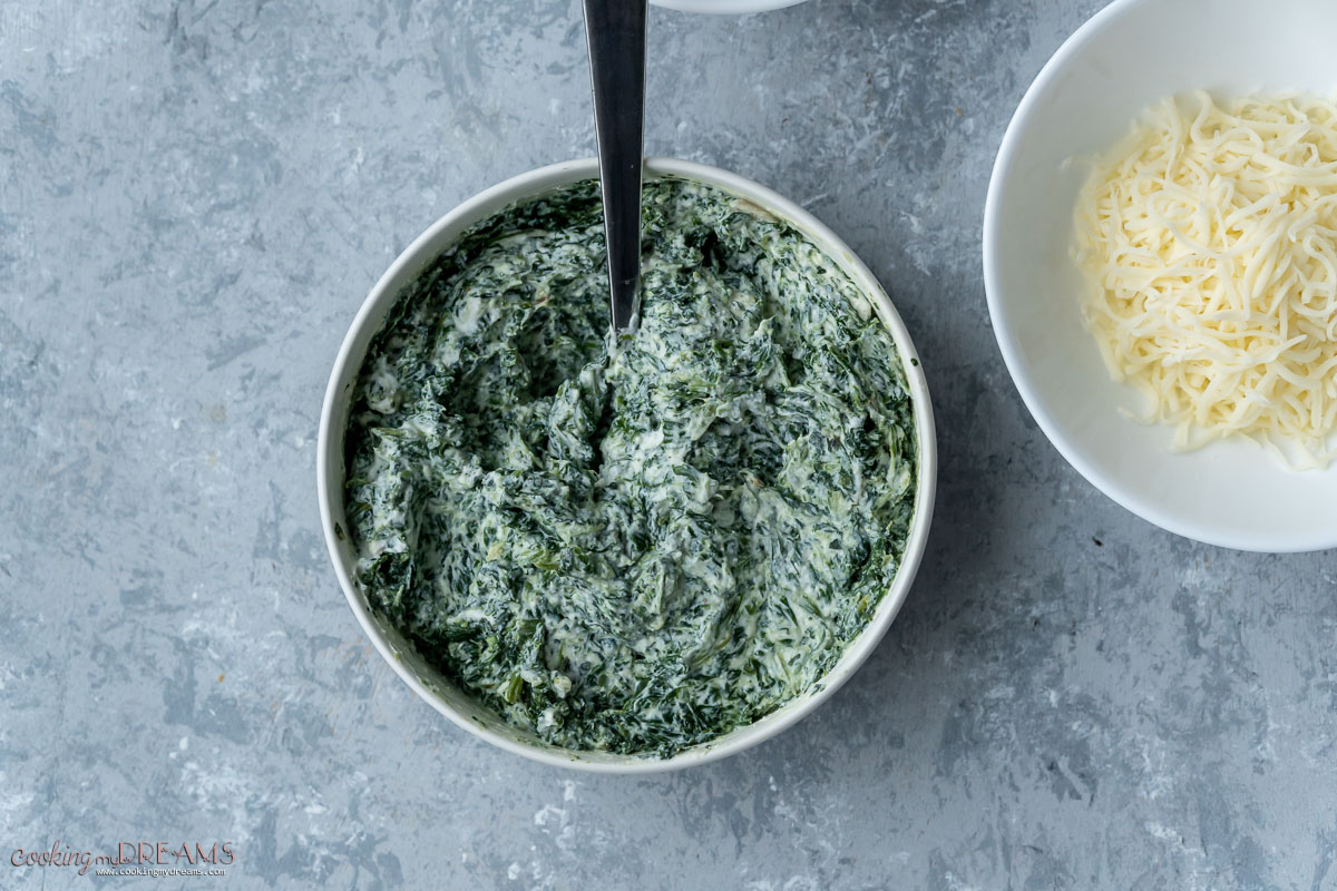 cooked spinach and ricotta mixed in a bowl