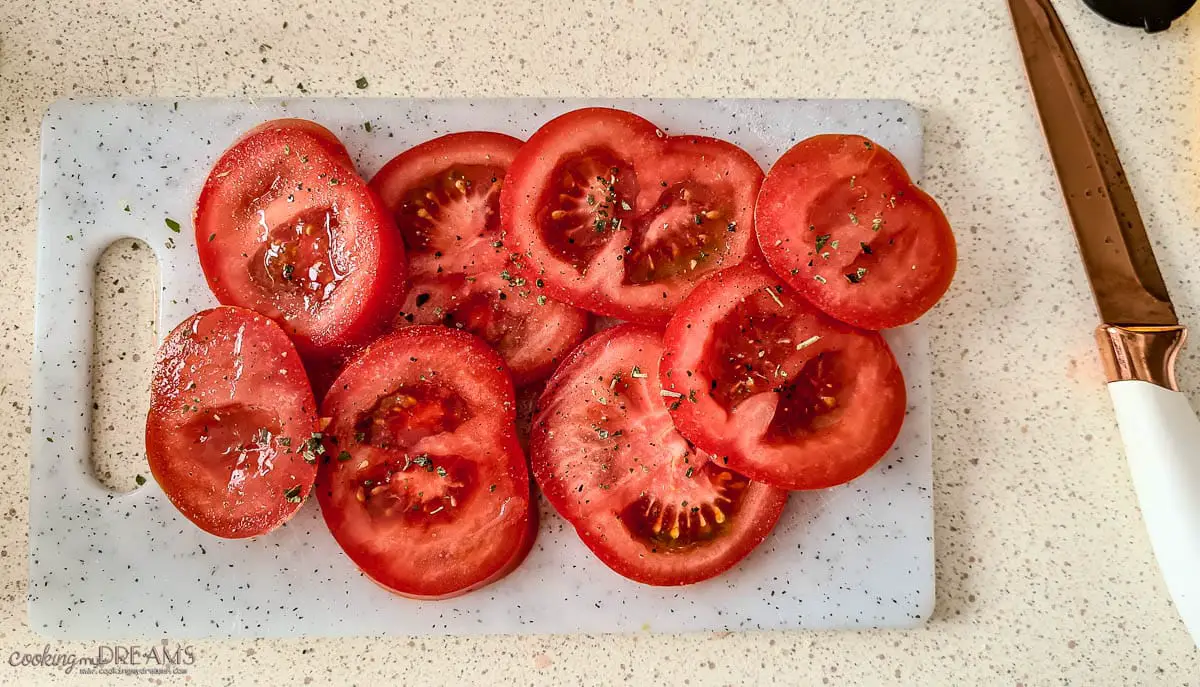 tomato slices on a cutting board