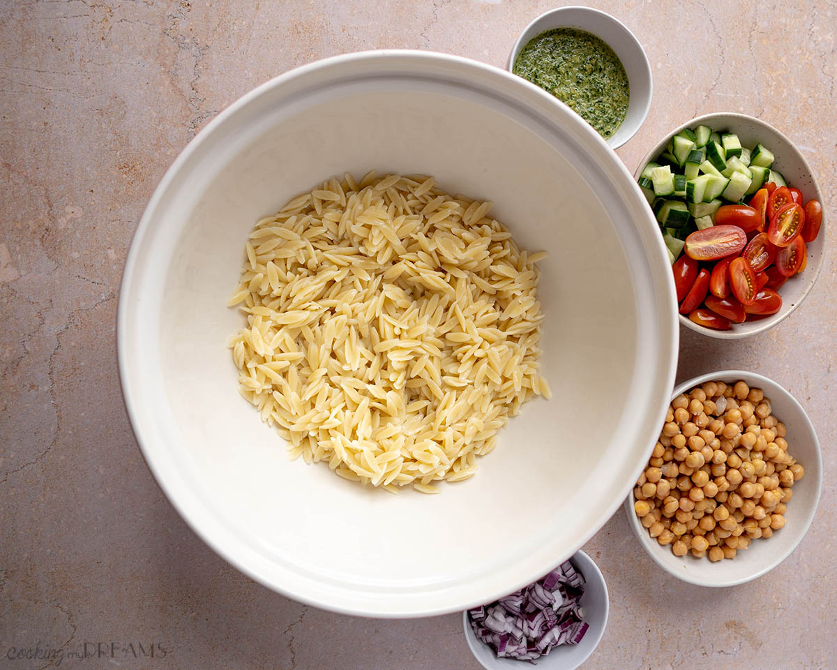orzo salad ingredients in separate bowls
