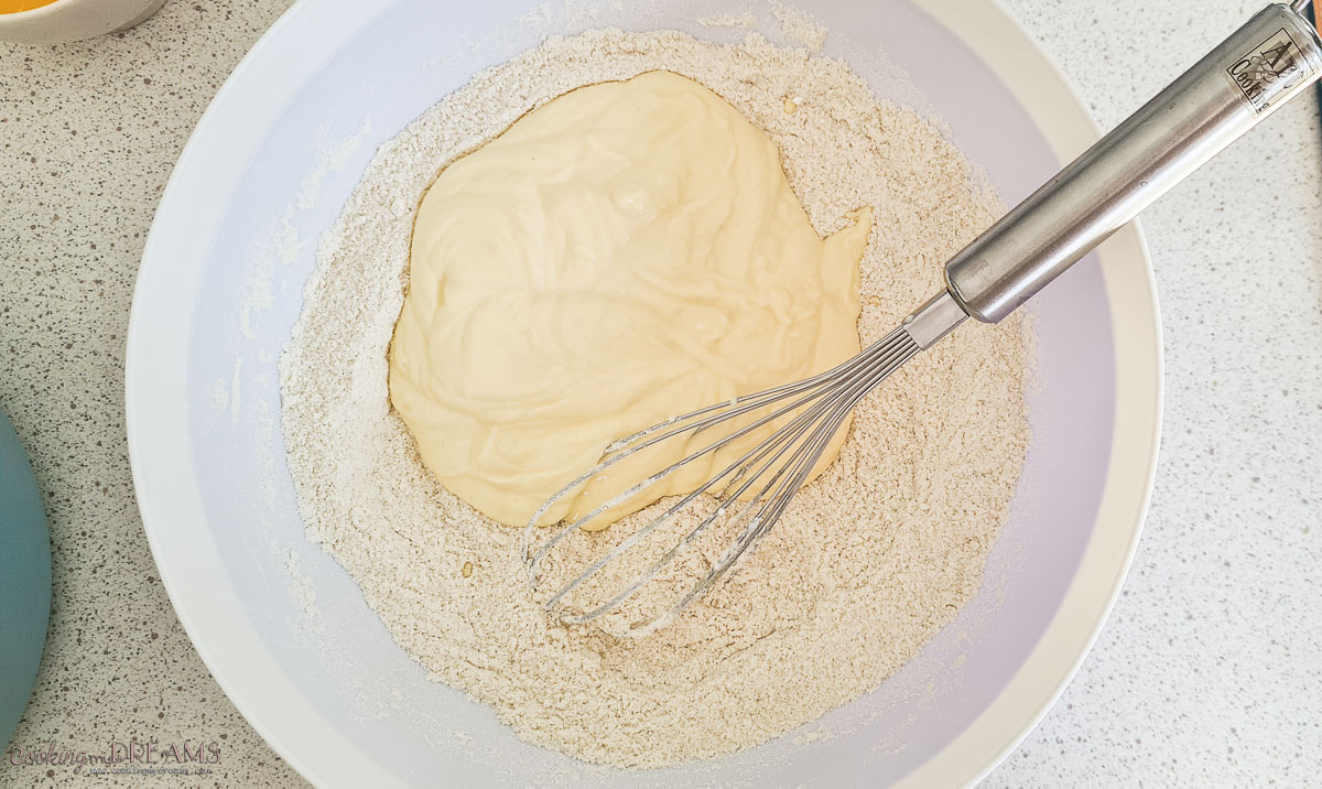 bowl with dry ingredients and wet ingredients together with a whisk