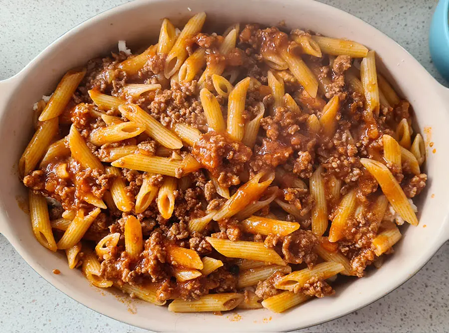 pasta with ragù sauce in a baking dish