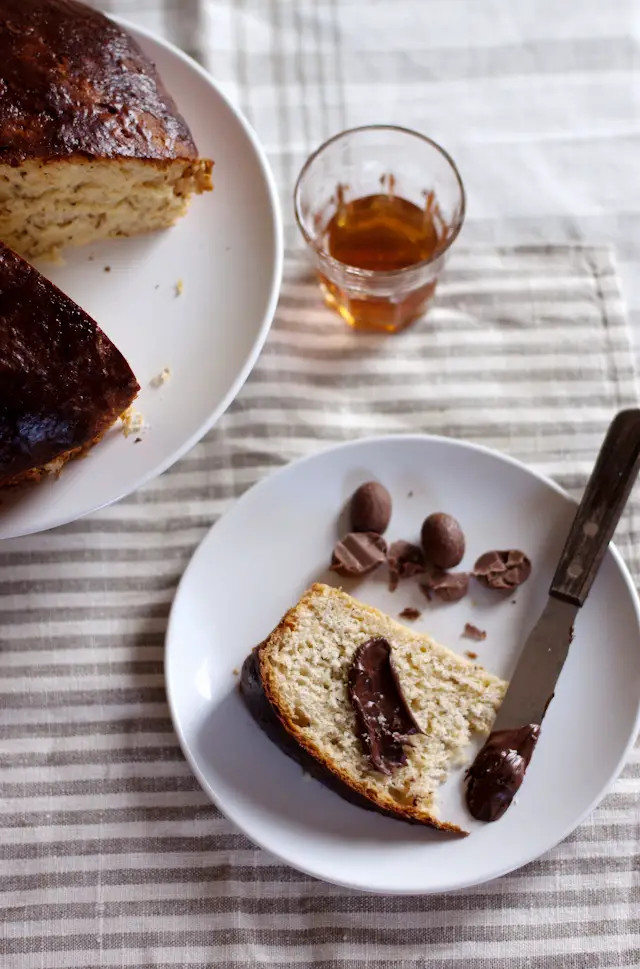 slice of easter schiacciata on a bread with chocolate and a knife