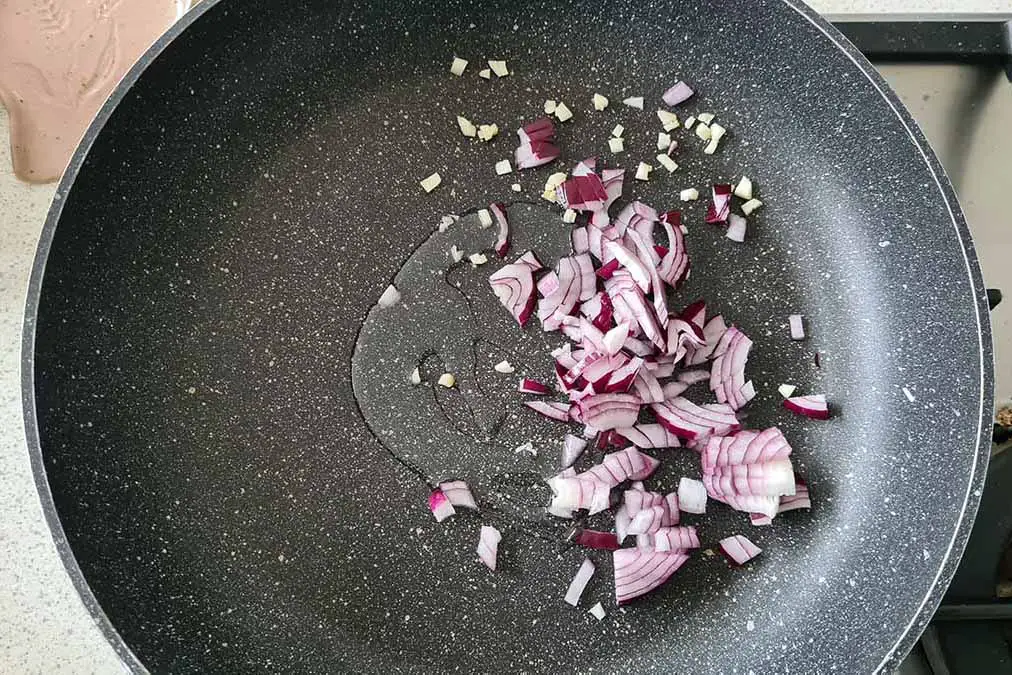 minced onions in a pan with olive oil