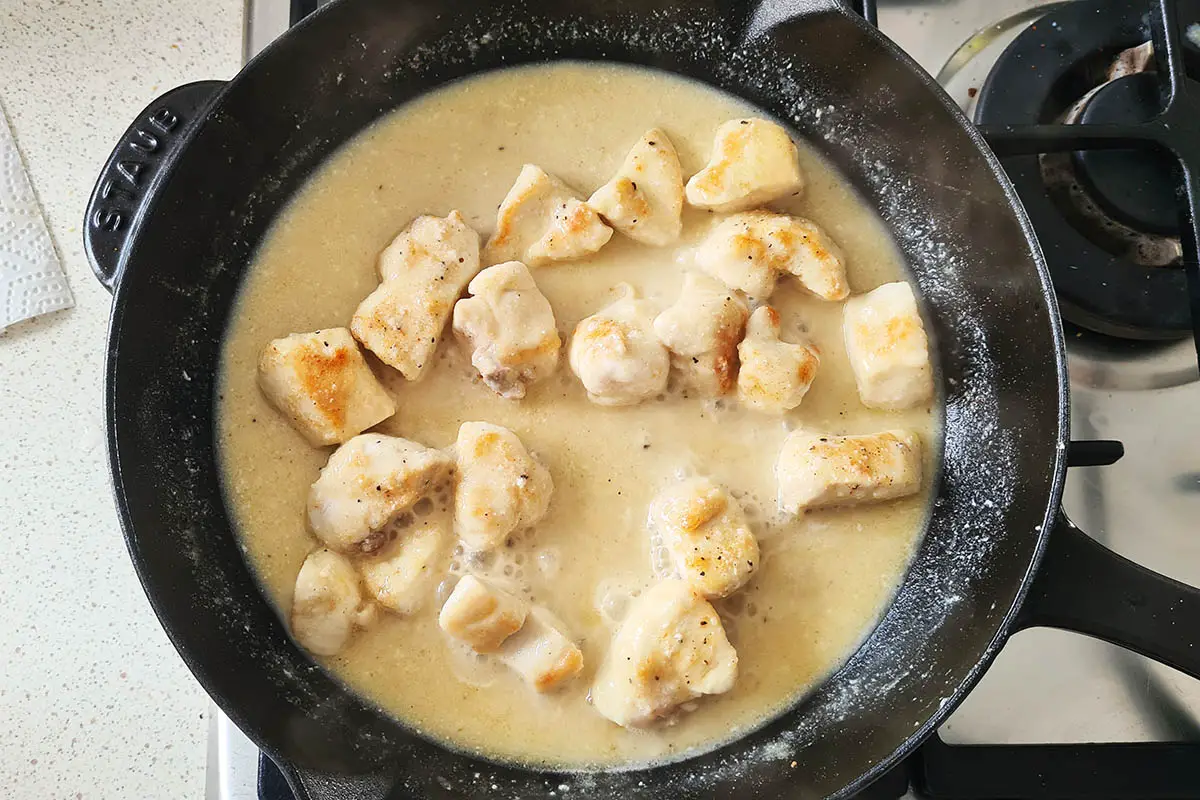 the creamy lemon chicken in simmering in the skillet.