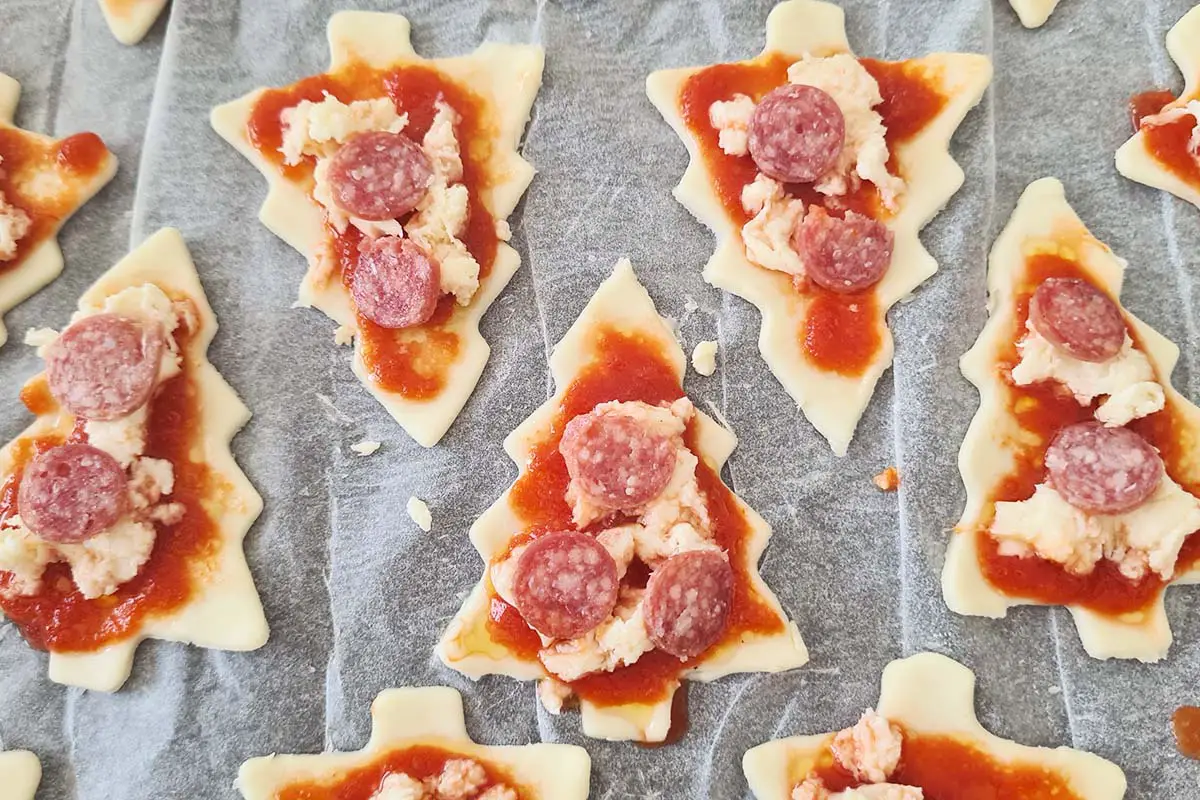 puff pastry christmas trees mini pizzas with tiny pepperoni.