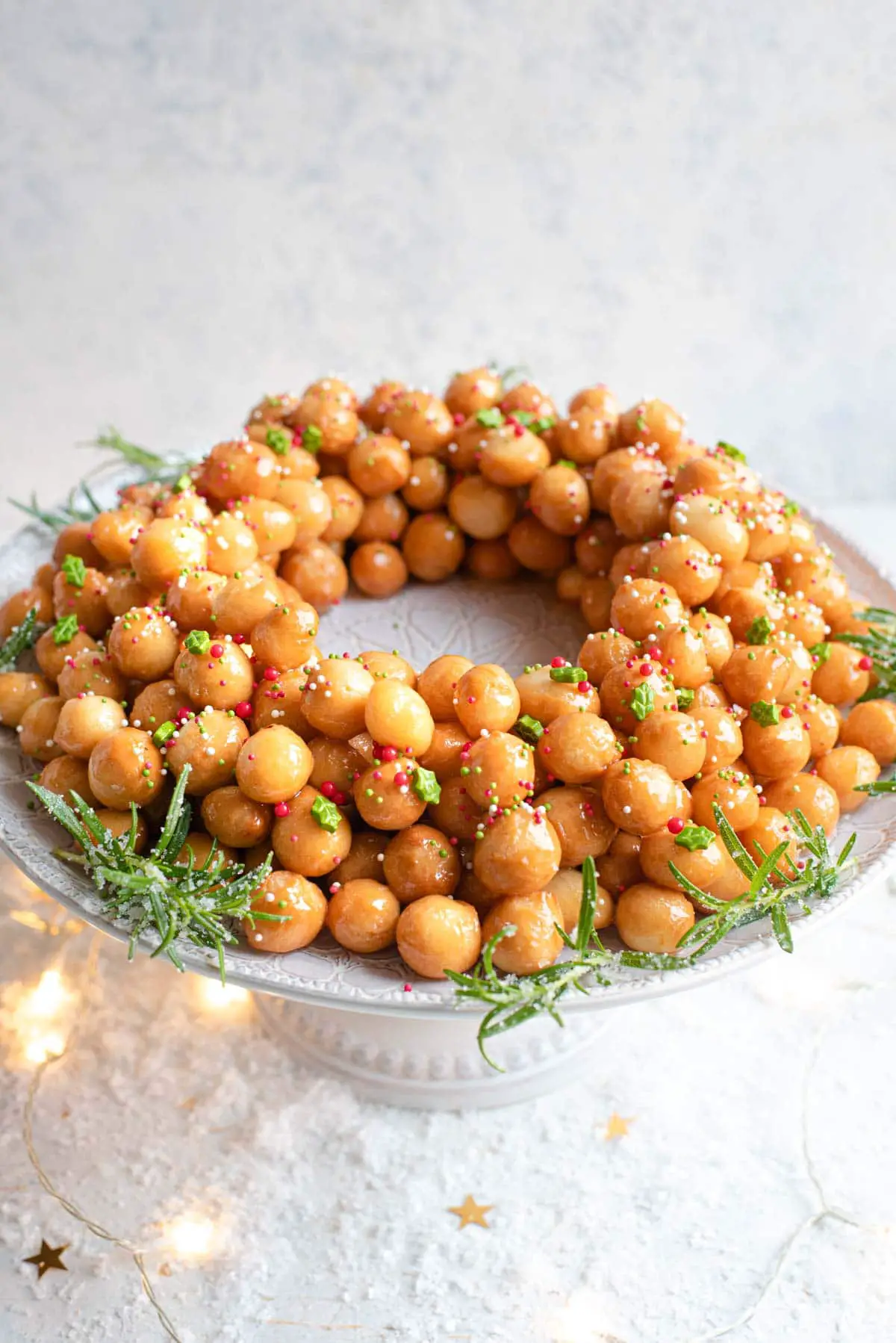 struffoli dough balls arranged as a wreath.