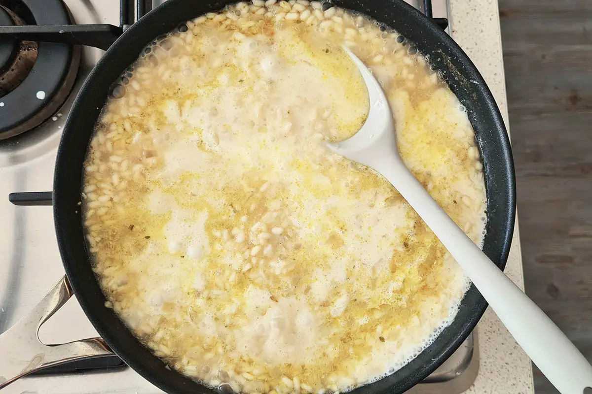 cream is added to the pan with the risotto.