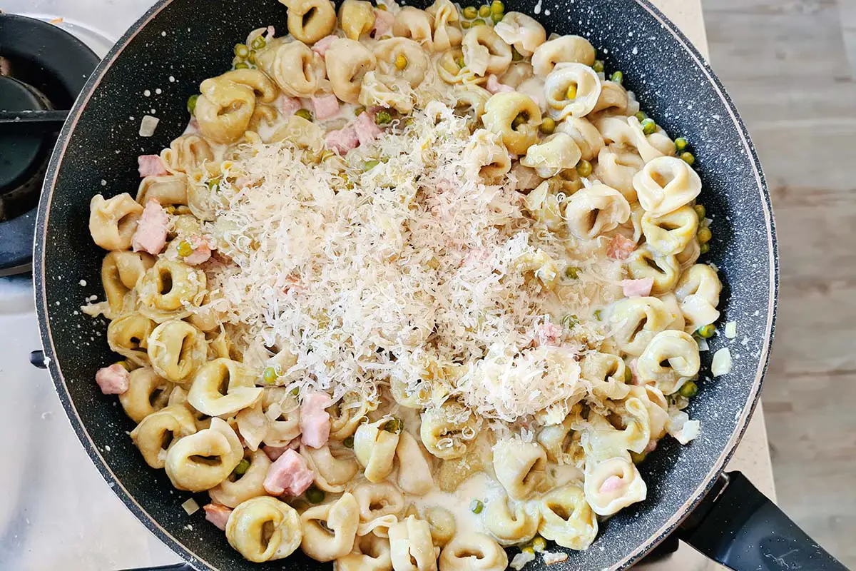 tortellini are added to the pan with the cream sauce.