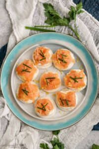 smoked salmon appetizer bites on a plate.