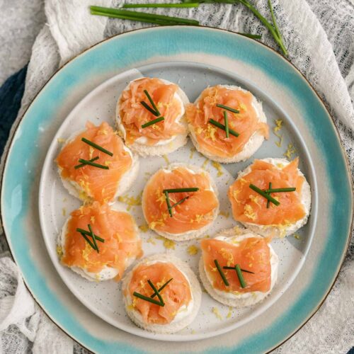 smoked salmon appetizer bites on a plate.