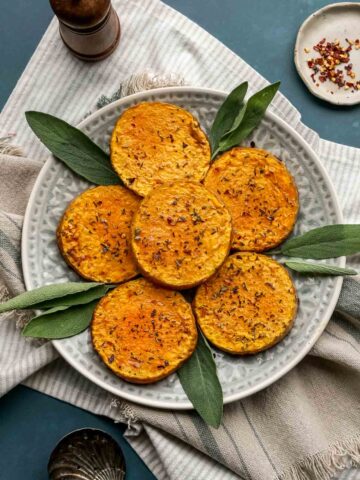 roasted butternut squash slices on a plate.