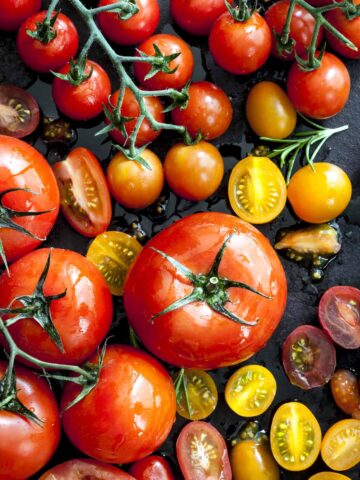 assortment of tomato varieties on a table.