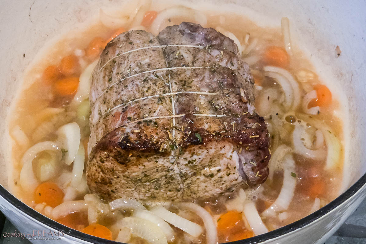 vegetables and stock are added to the meat.