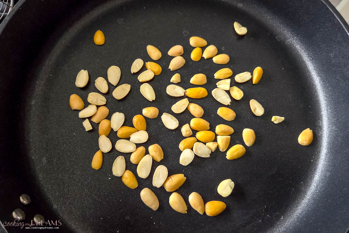 almonds toasting in a pan.